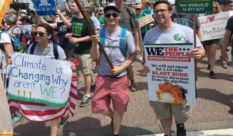 Seth Levin and Ed Potosnak march at the People's Climate March.