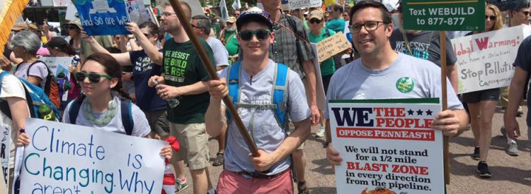 Seth Levin and Ed Potosnak march at the People's Climate March.